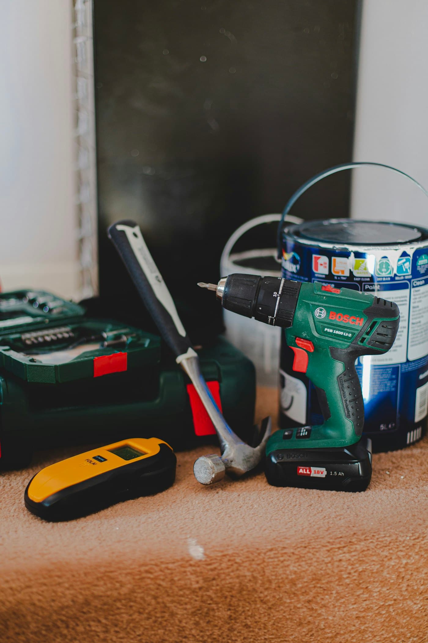 Closet installer's tools and drill laid out ready for a job that never closed